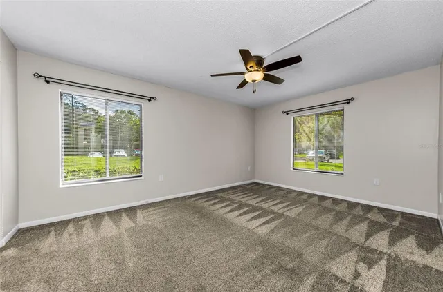a view of an empty room and a window