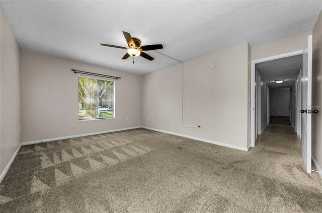 a view of an empty room and window