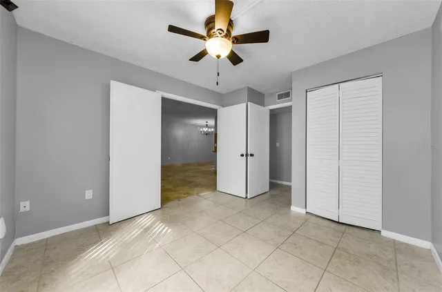 a bathroom with a sink a toilet a mirror and bathtub