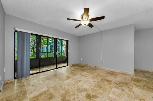 a view of a livingroom with a chandelier fan