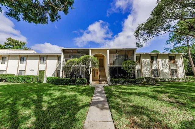 a view of a porch and garden