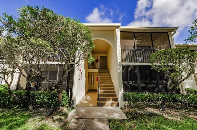 a view of staircase with lots of stuff on both side