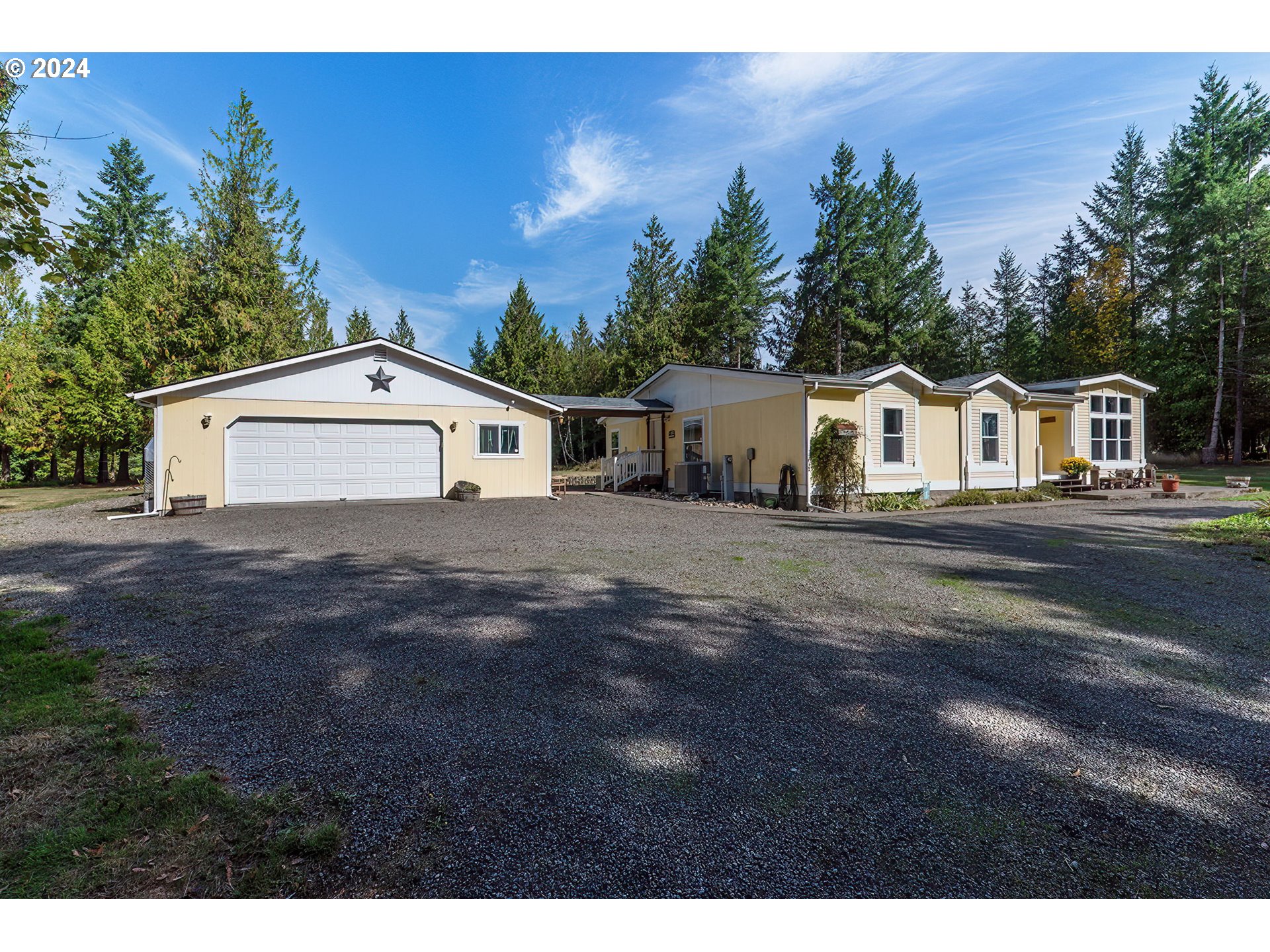 110-81 Rawlins Road Winlock, WA 98596 - Photo 1 of 32 a view of a white house with a yard