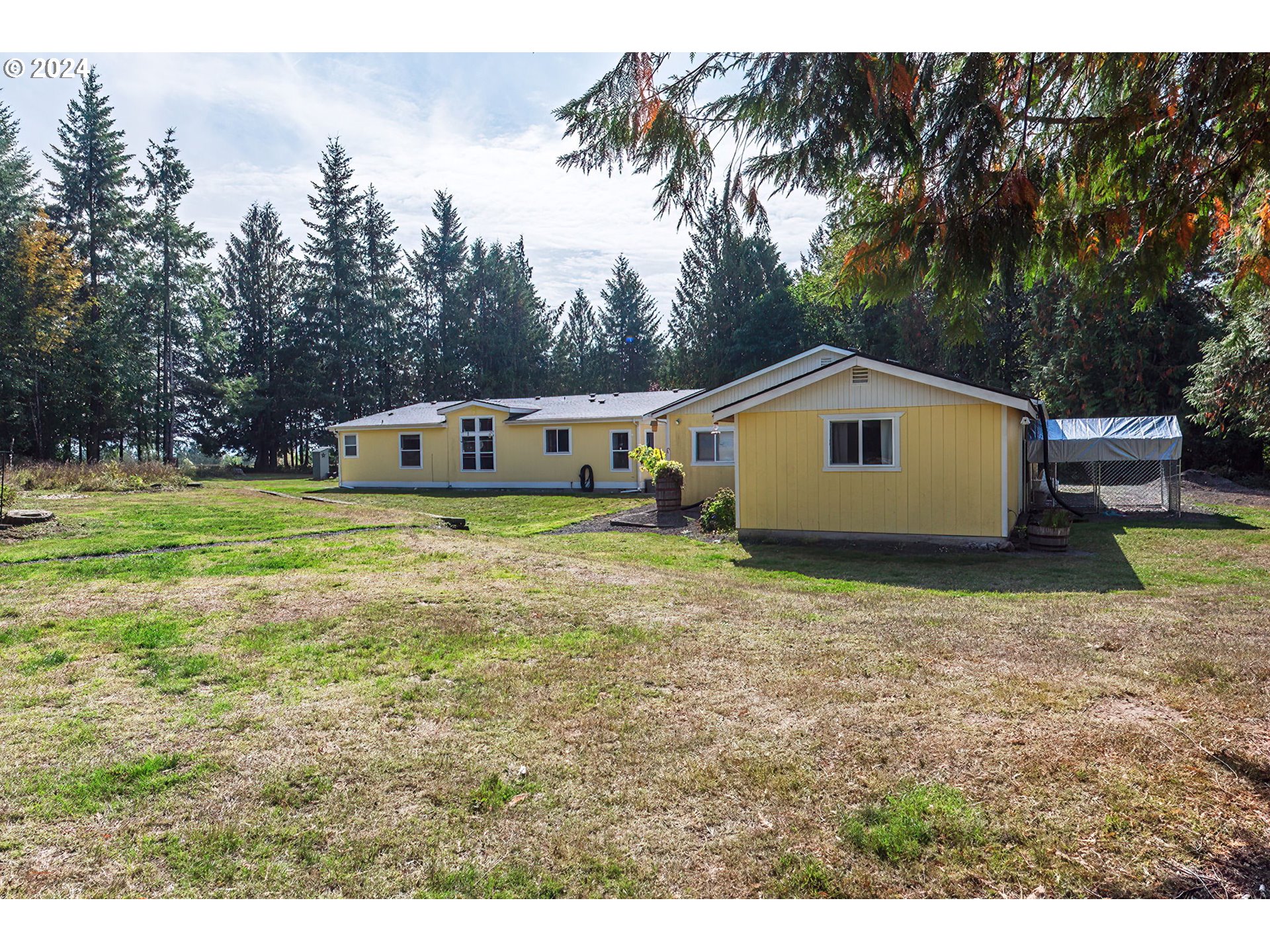 110-81 Rawlins Road Winlock, WA 98596 - Photo 23 of 32 a house view with a garden space