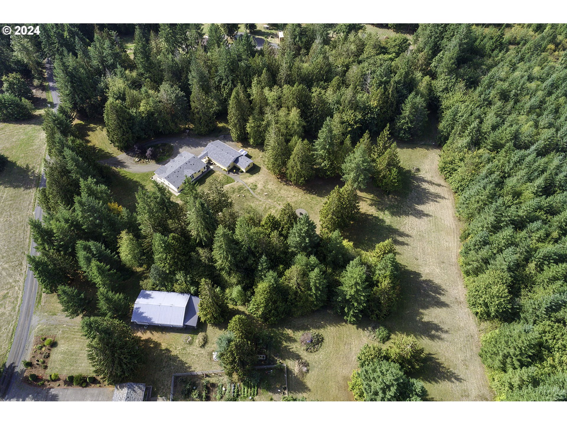 110-81 Rawlins Road Winlock, WA 98596 - Photo 30 of 32 a aerial view of residential house with outdoor space and trees all around
