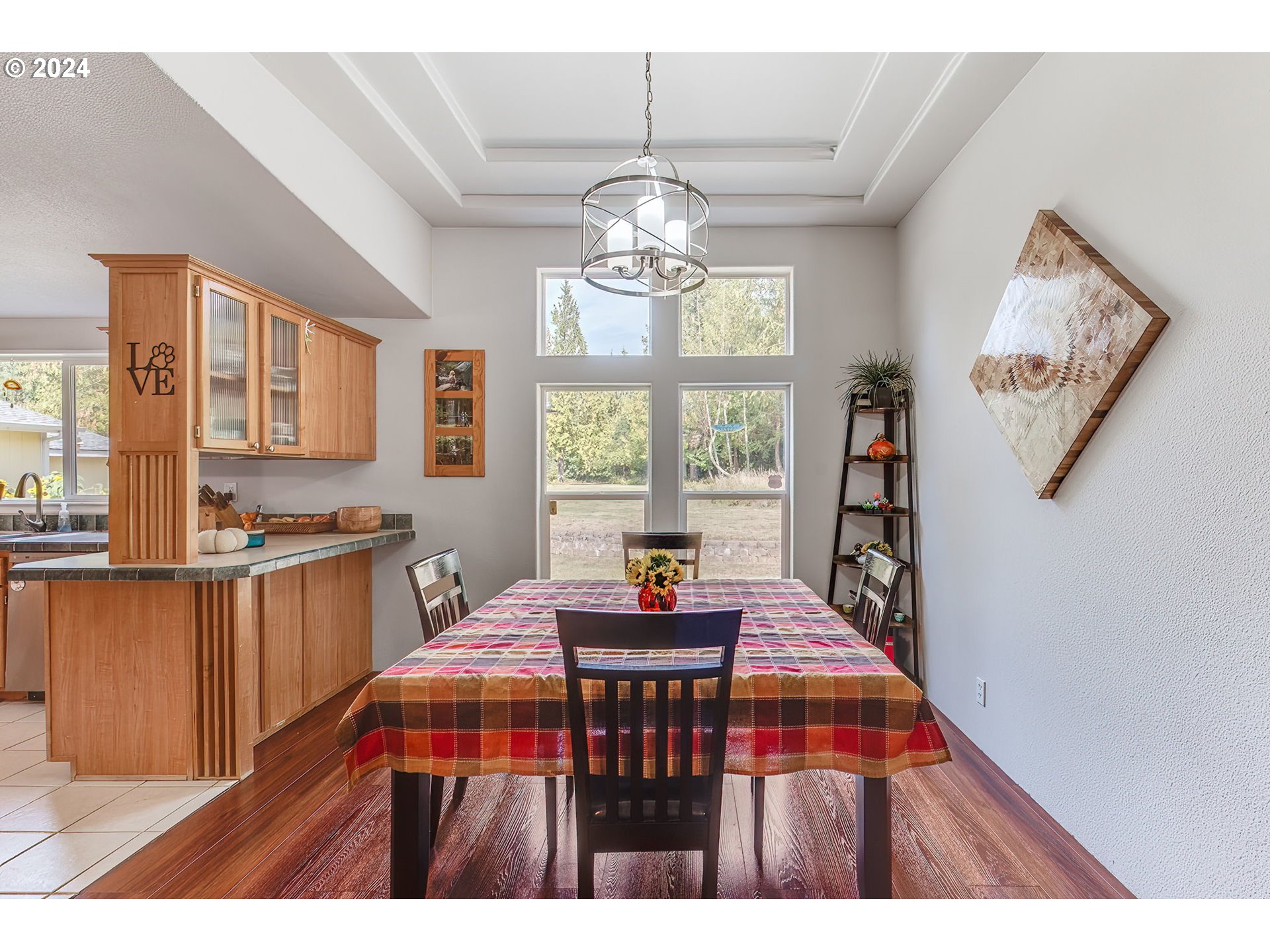 110-81 Rawlins Road Winlock, WA 98596 - Photo 8 of 32 a kitchen view of a dining table chairs and chandelier