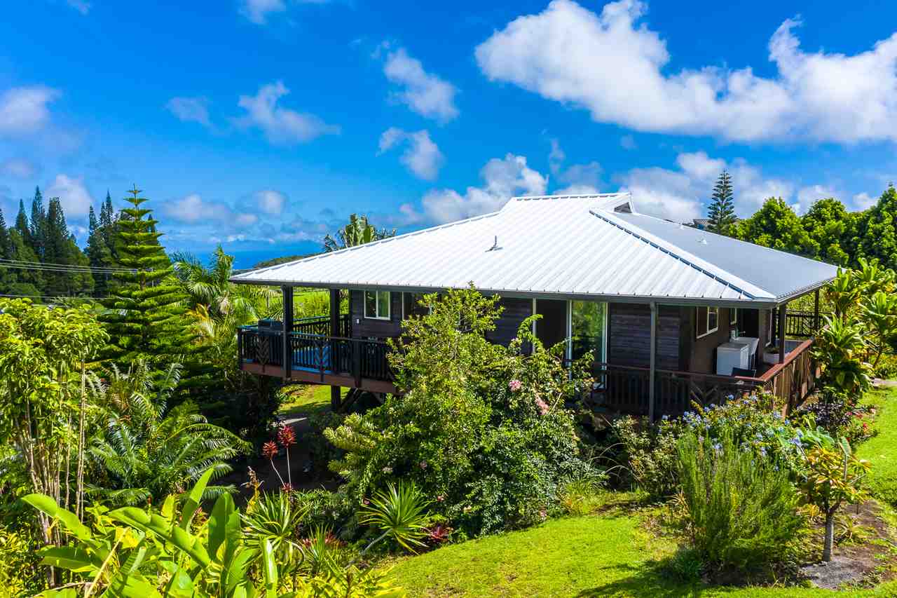 748 Awalau Road, Unit A Haiku, HI 96708 - Photo 8 of 30 a view of a house with a yard and sitting area