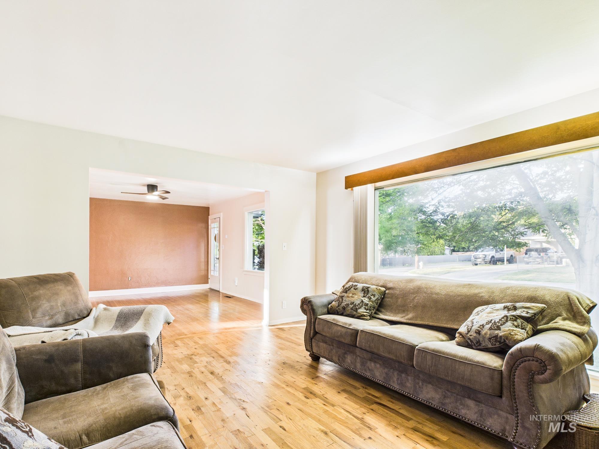 3422 6th Street Lewiston, ID 83501 - Photo 10 of 43 Bright living area featuring wood-finish flooring and a large picture window