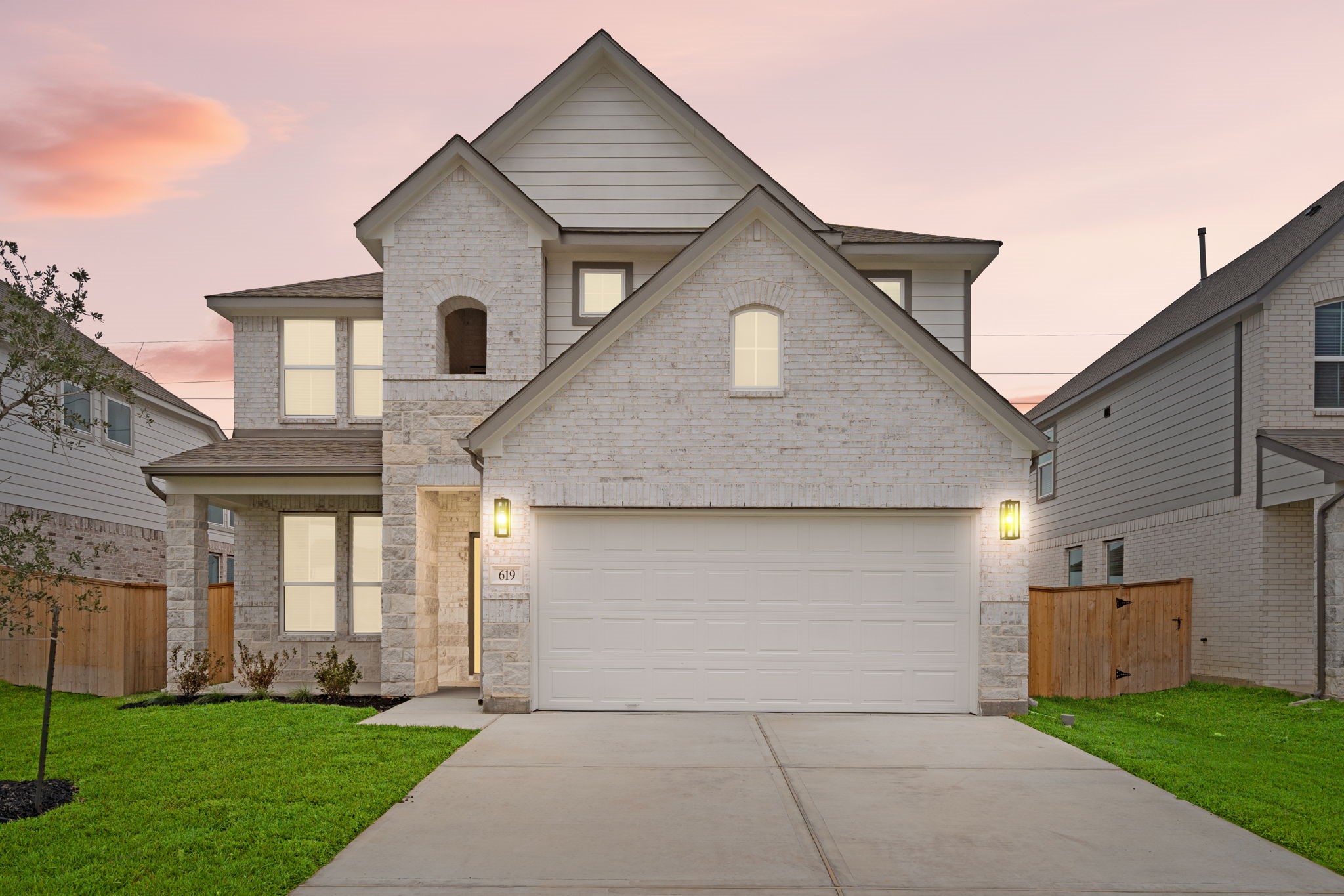 a front view of a house with a yard