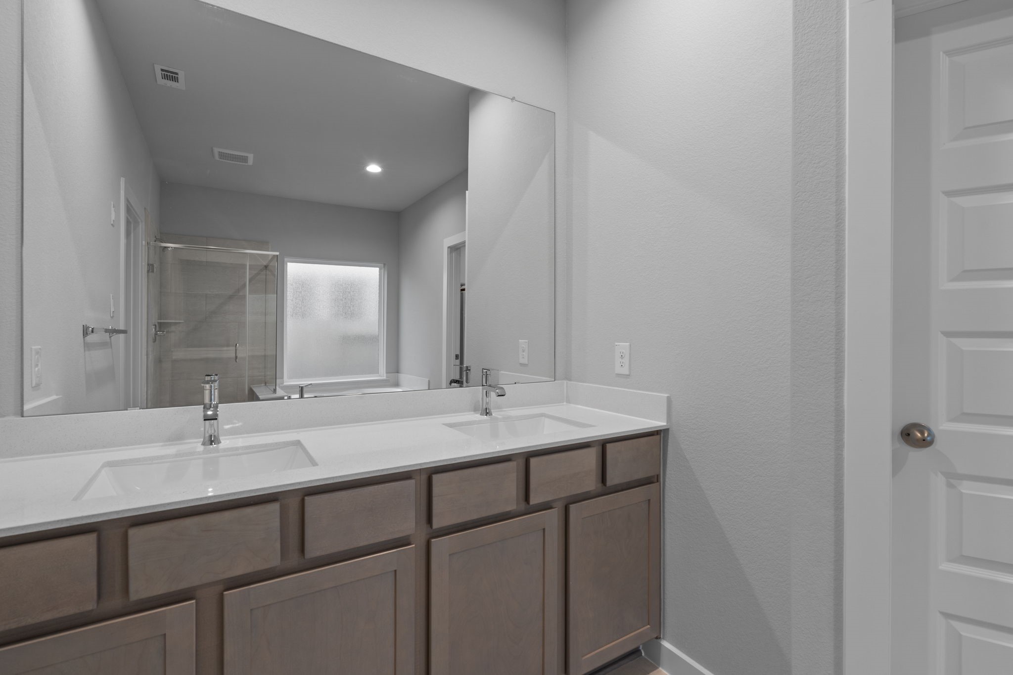 619 Yard Master Trail Rosharon, TX 77583 - Photo 28 of 46 a bathroom with a double vanity sink and mirror