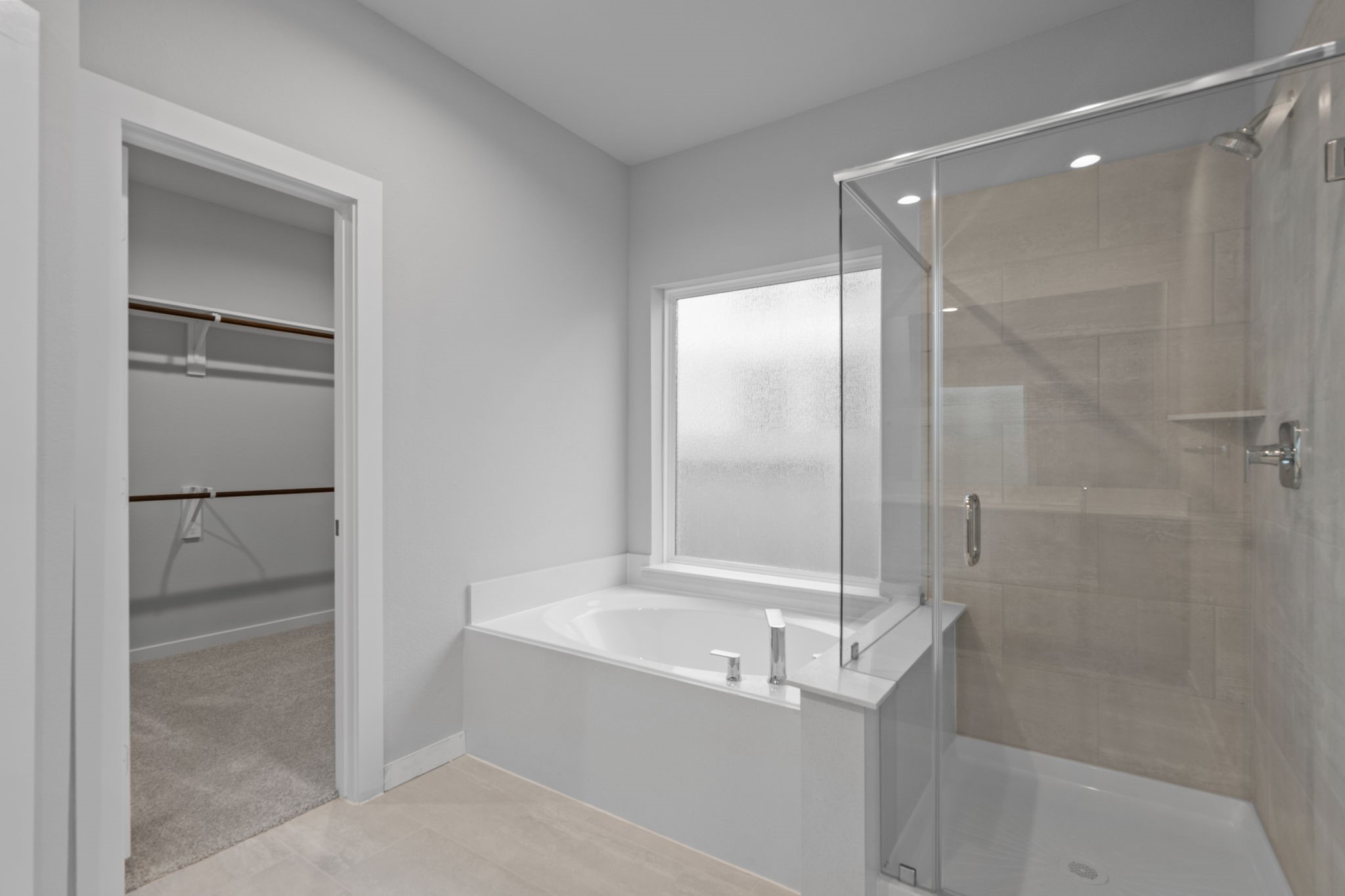 619 Yard Master Trail Rosharon, TX 77583 - Photo 29 of 46 a bathroom with a bathtub and a shower