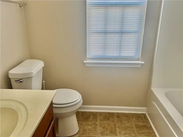 a bathroom with a toilet and a sink