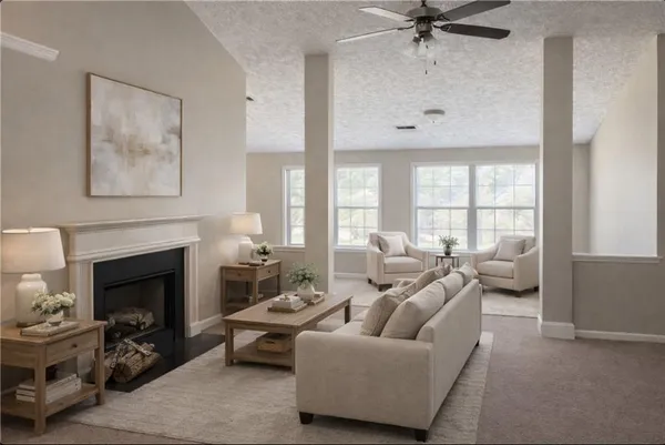 a living room with furniture and a fireplace