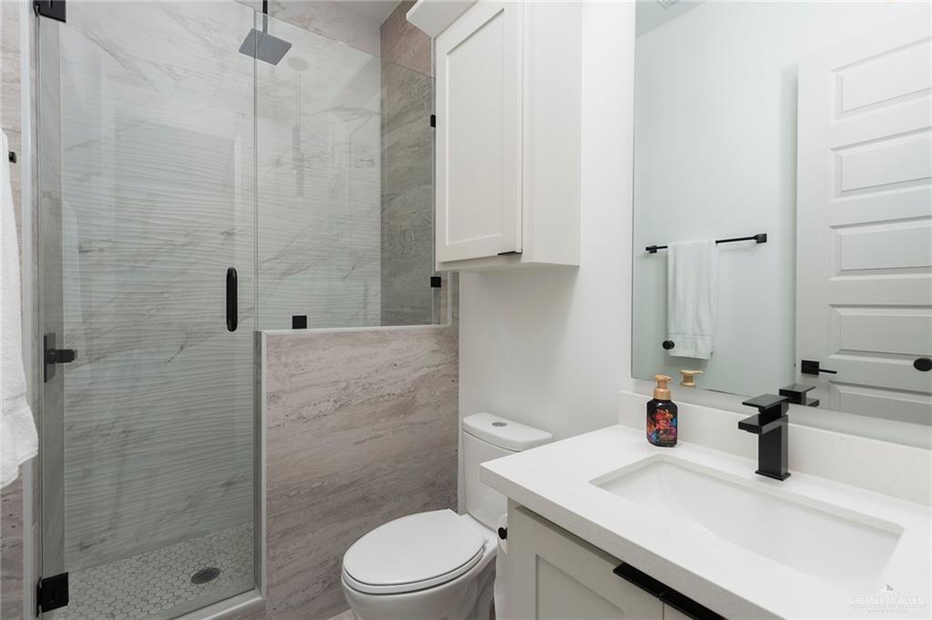 1505 Mount Street Mission, TX 78572 - Photo 18 of 25 Bathroom with vanity, toilet, and walk in shower