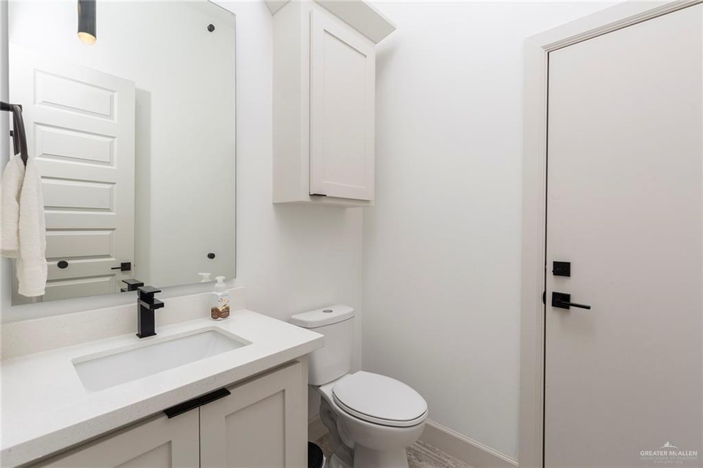 1505 Mount Street Mission, TX 78572 - Photo 19 of 25 Bathroom with vanity and toilet