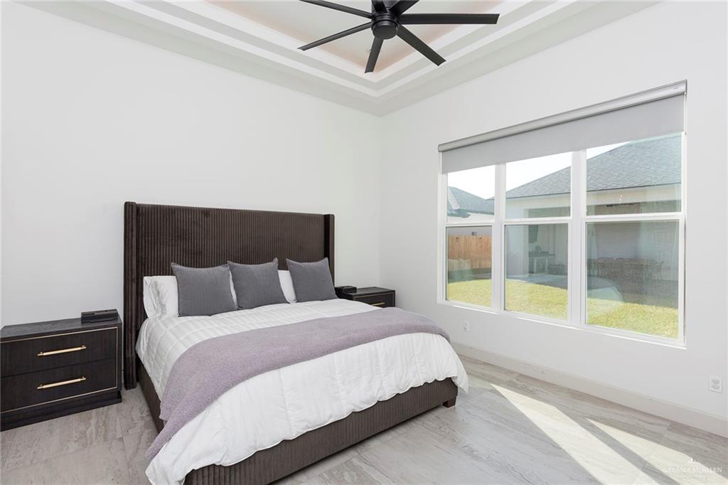 1505 Mount Street Mission, TX 78572 - Photo 22 of 25 Bedroom with ceiling fan and a raised ceiling