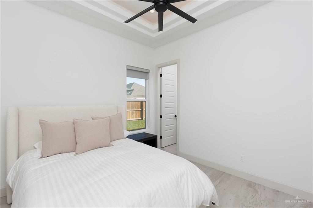 1505 Mount Street Mission, TX 78572 - Photo 24 of 25 Bedroom featuring ceiling fan and a tray ceiling