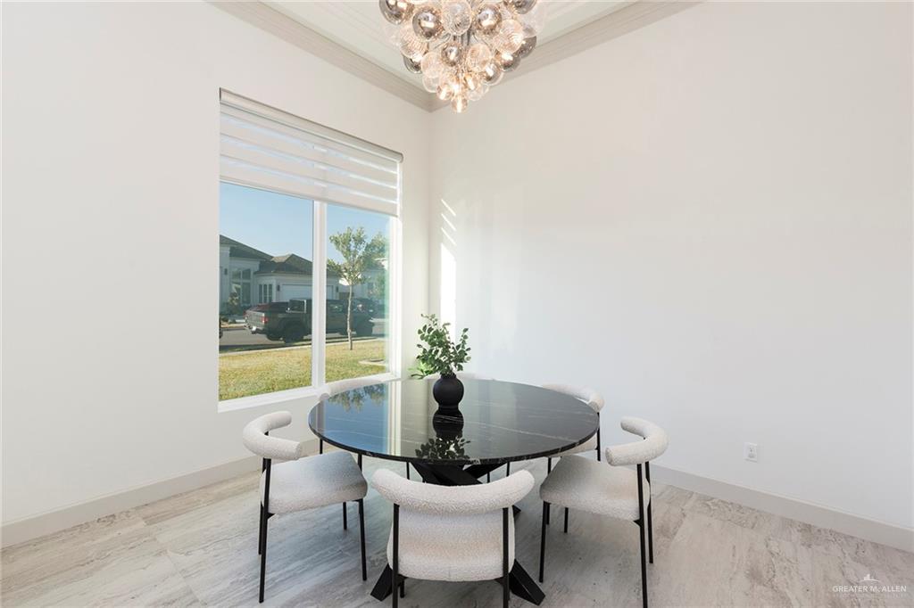 1505 Mount Street Mission, TX 78572 - Photo 10 of 25 Dining space with ornamental molding and a chandelier