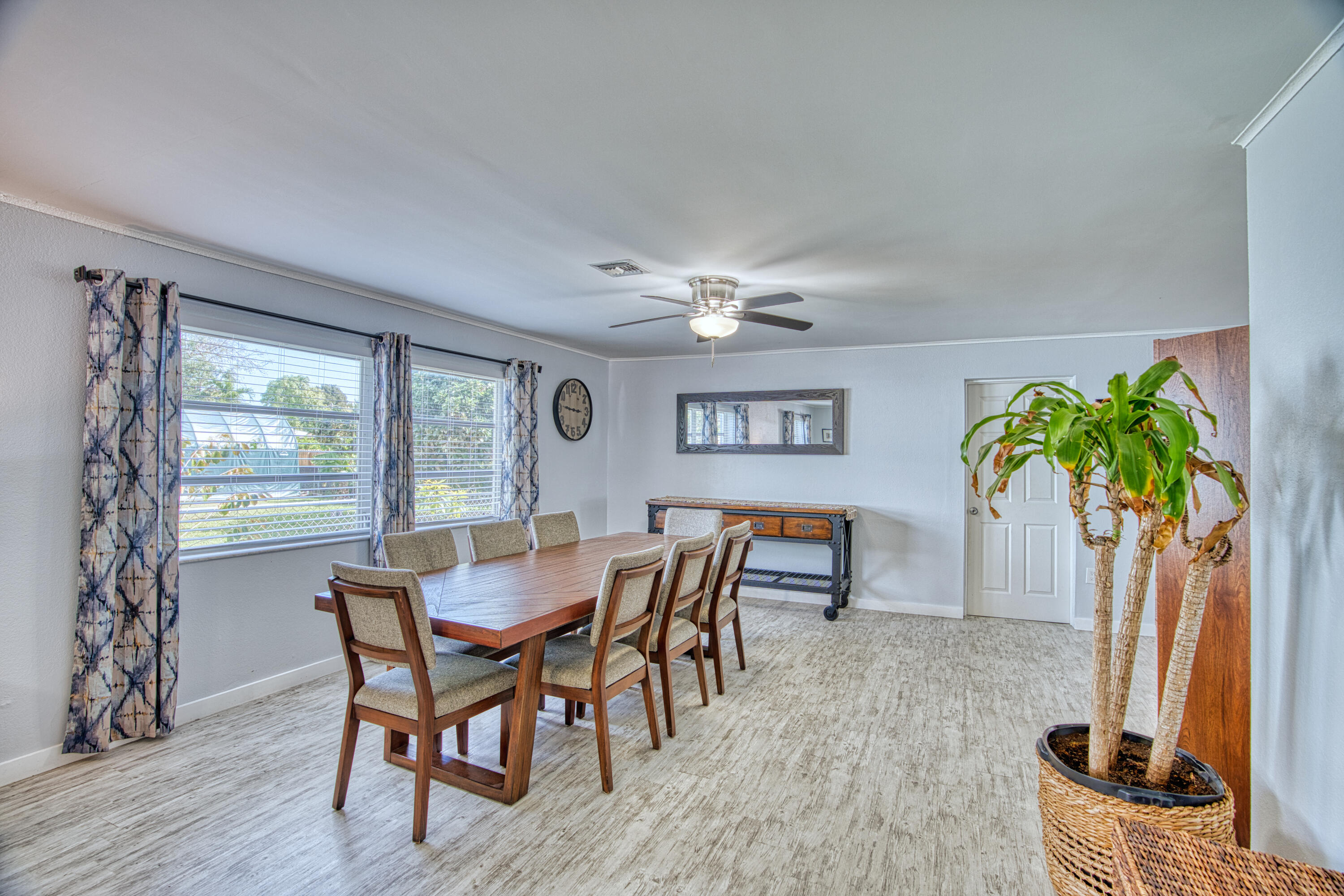 136 1st Road Key Largo, FL 33037 - Photo 17 of 45 a view of a dining room with furniture and a potted plant