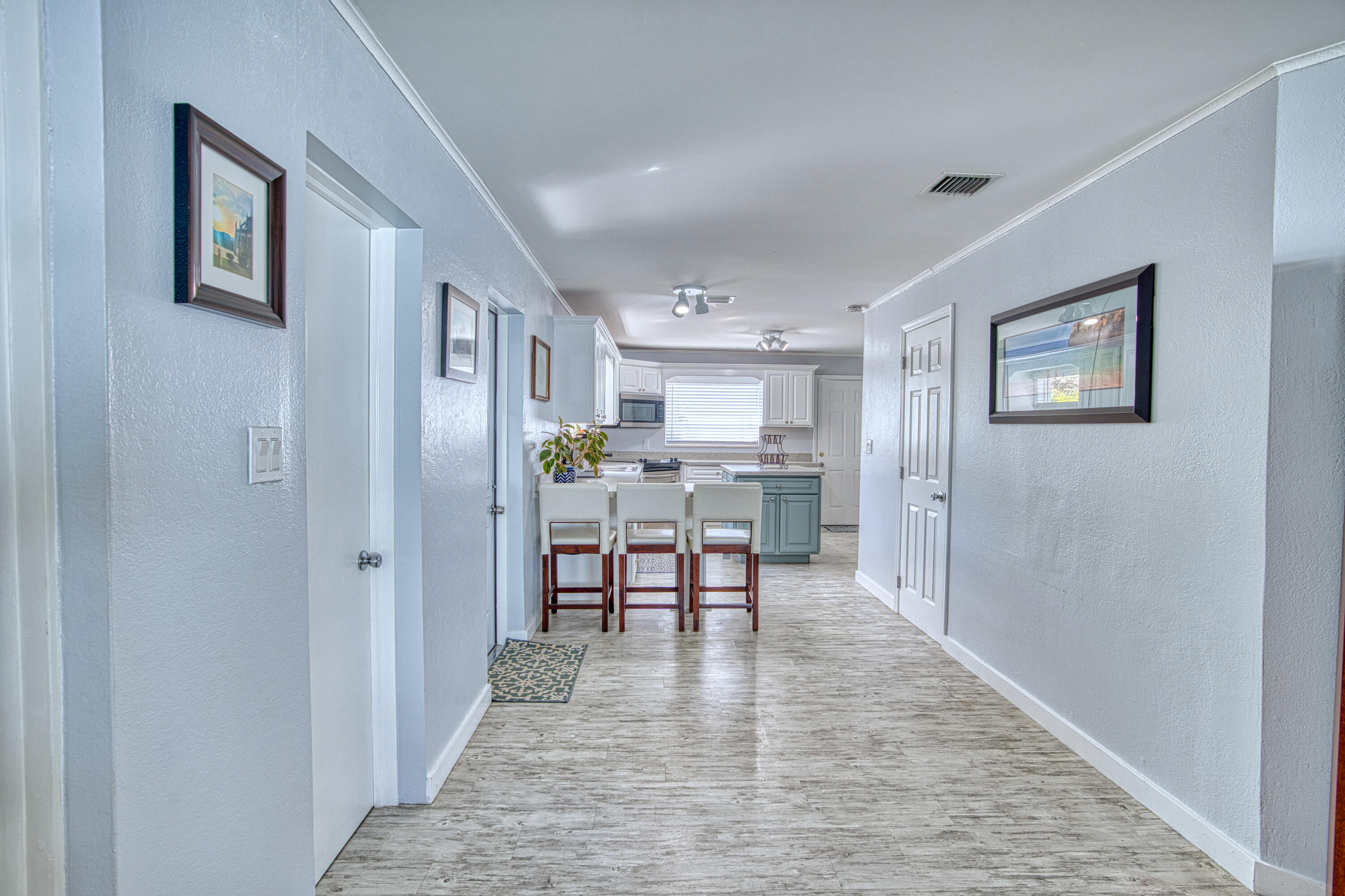 136 1st Road Key Largo, FL 33037 - Photo 21 of 45 a dining room with stainless steel appliances kitchen island furniture and wooden floor