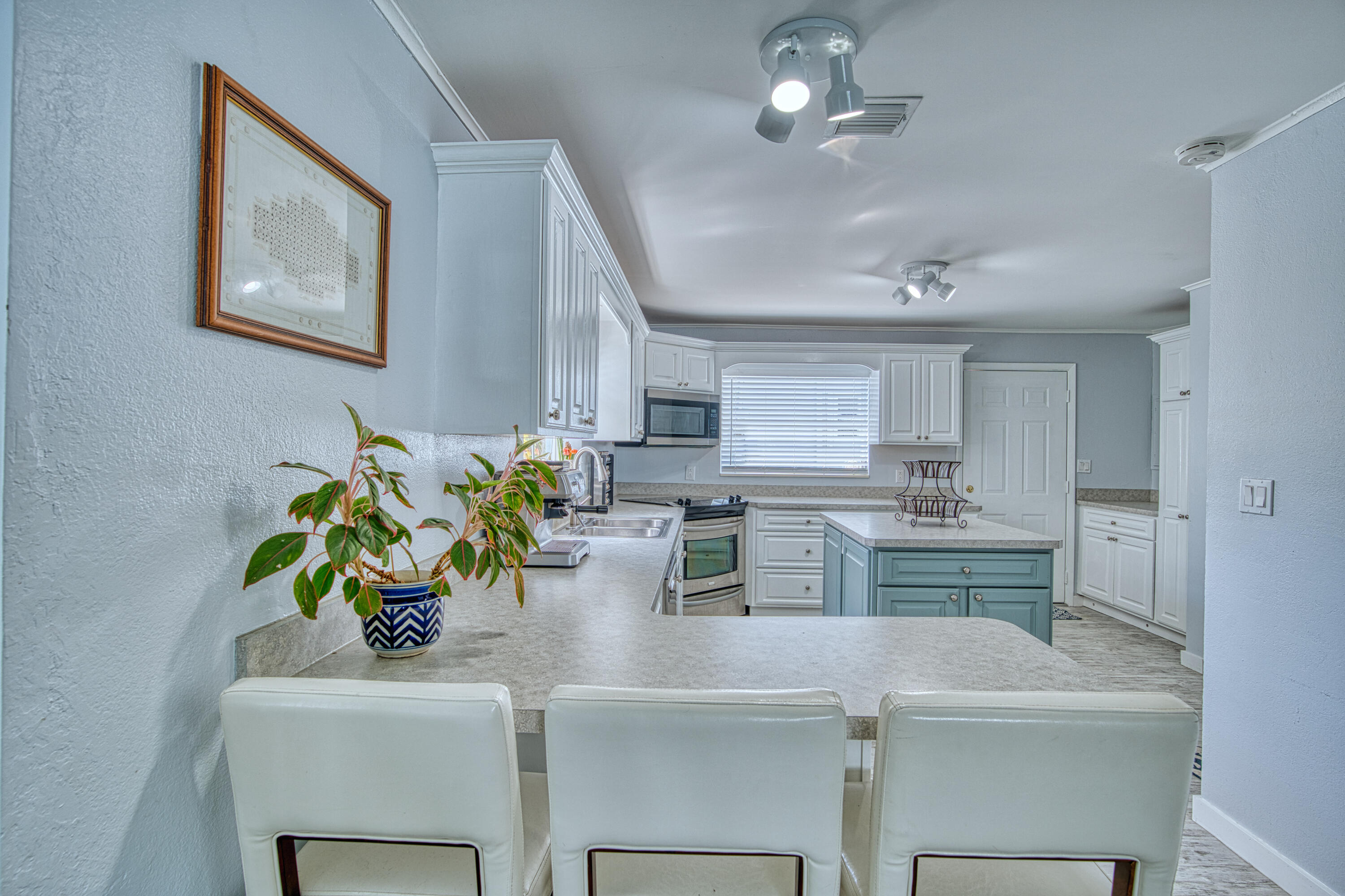 136 1st Road Key Largo, FL 33037 - Photo 24 of 45 a kitchen with a counter top space appliances and cabinets