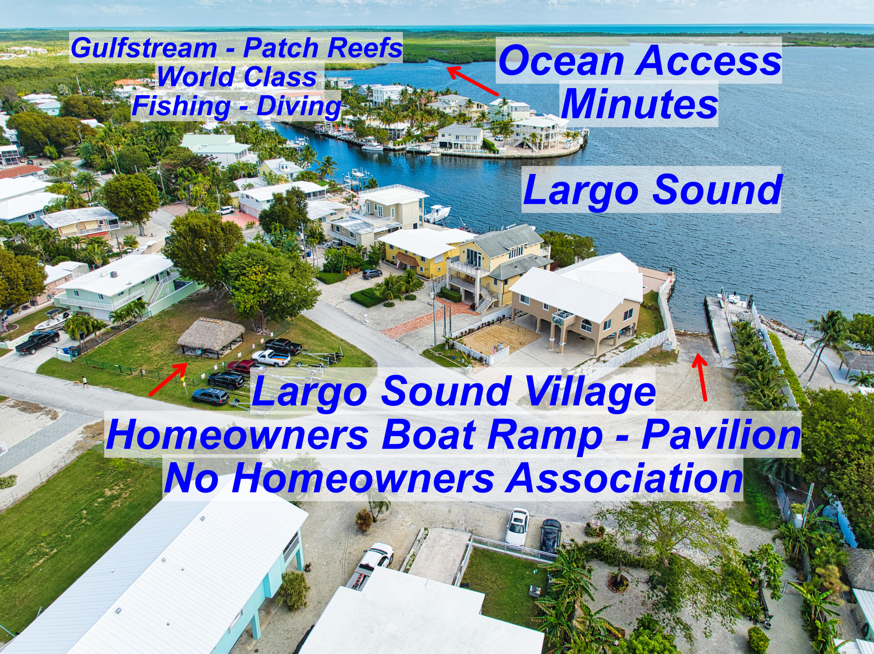 136 1st Road Key Largo, FL 33037 - Photo 3 of 45 a sign that is sitting on a wooden wall