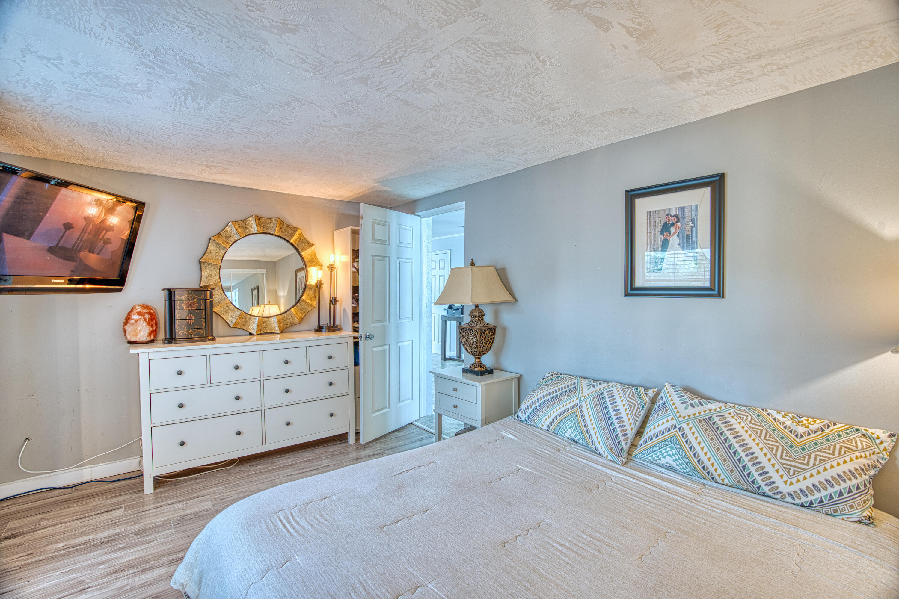 136 1st Road Key Largo, FL 33037 - Photo 31 of 45 a bedroom with a bed and a dresser in it