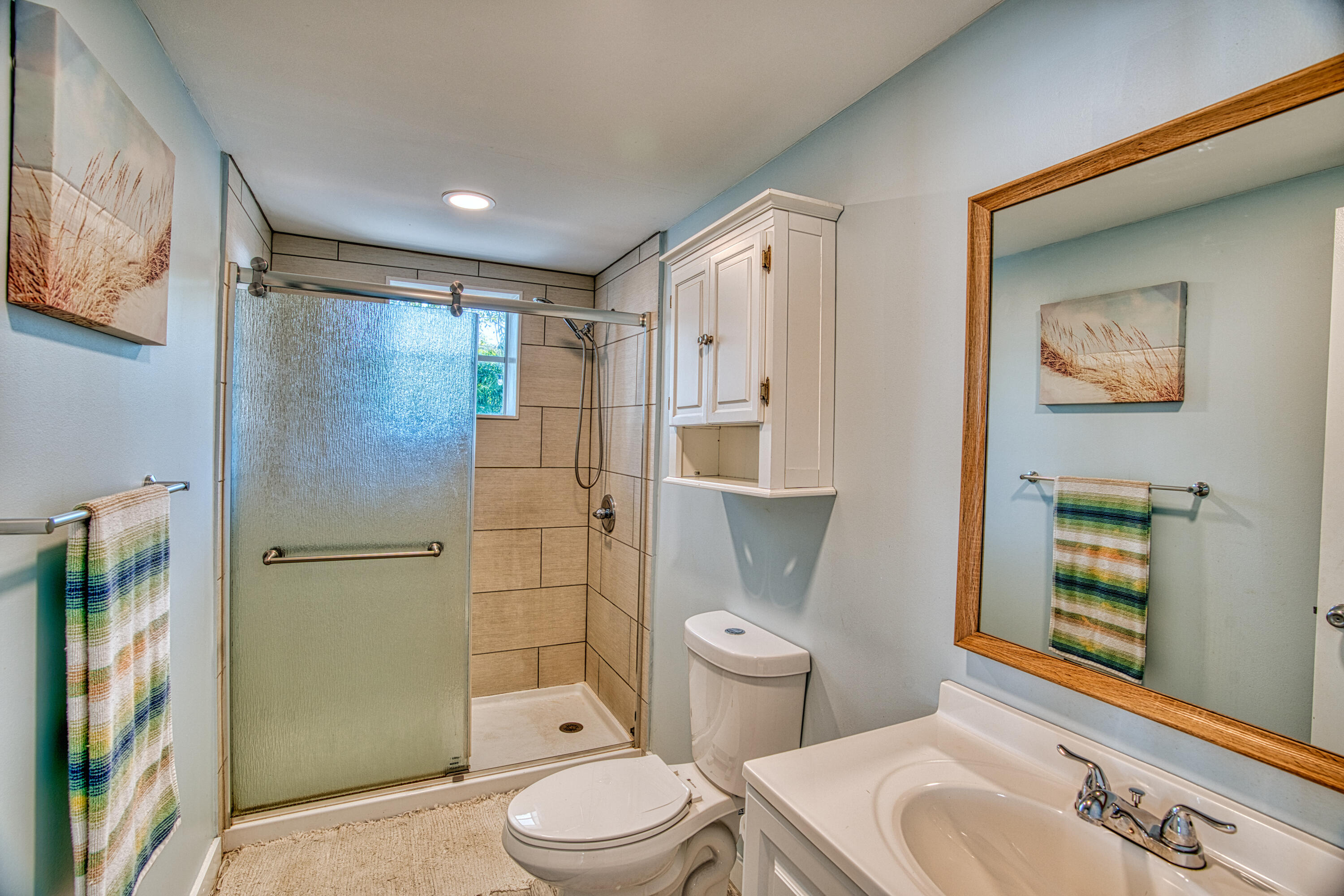 136 1st Road Key Largo, FL 33037 - Photo 33 of 45 a bathroom with a toilet a sink and shower