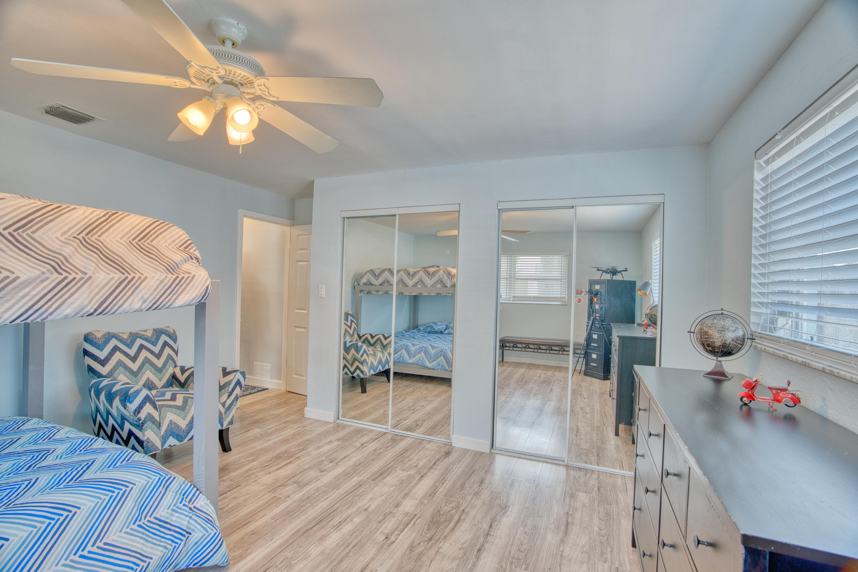 136 1st Road Key Largo, FL 33037 - Photo 42 of 45 a bedroom with furniture and a chandelier