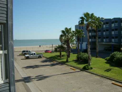3938 Surfside, Unit 2126 Corpus Christi, TX 78402 - Photo 2 of 7 a view of a backyard with plants and a garden