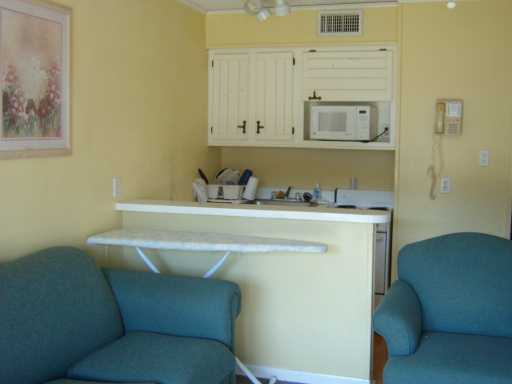 3938 Surfside, Unit 2126 Corpus Christi, TX 78402 - Photo 4 of 7 a bathroom with a sink toilet and mirror