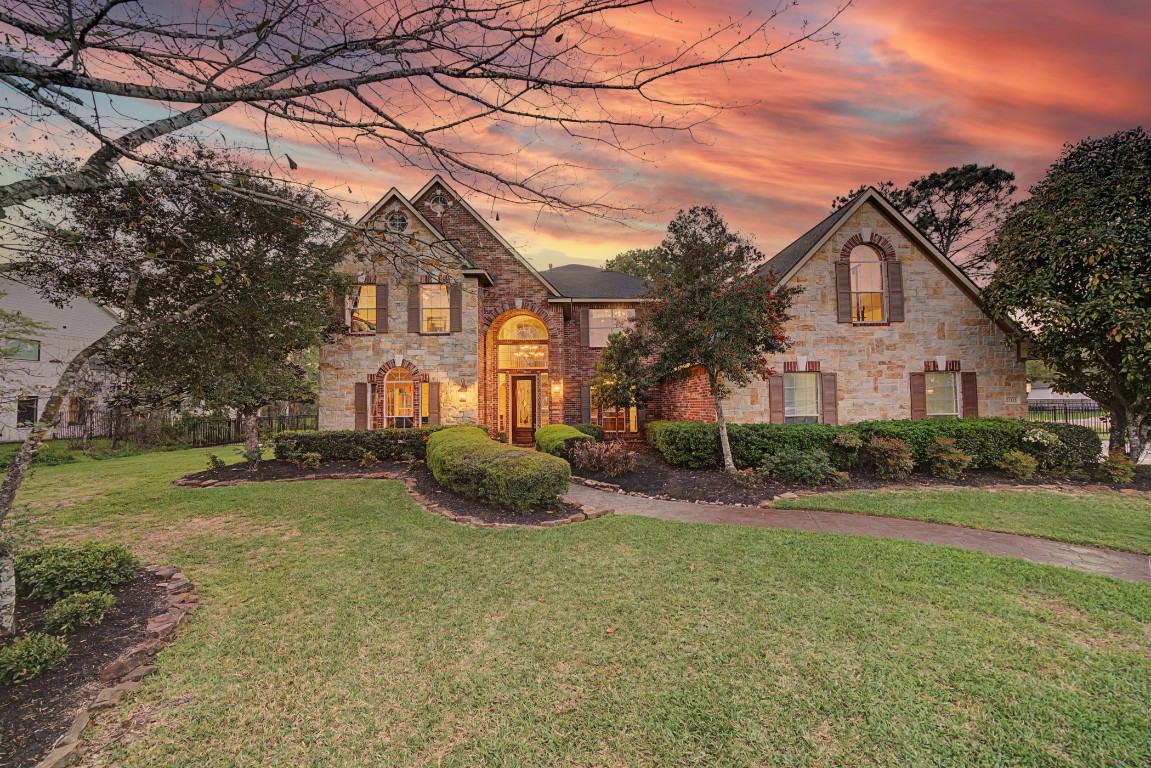 a front view of a house with a yard