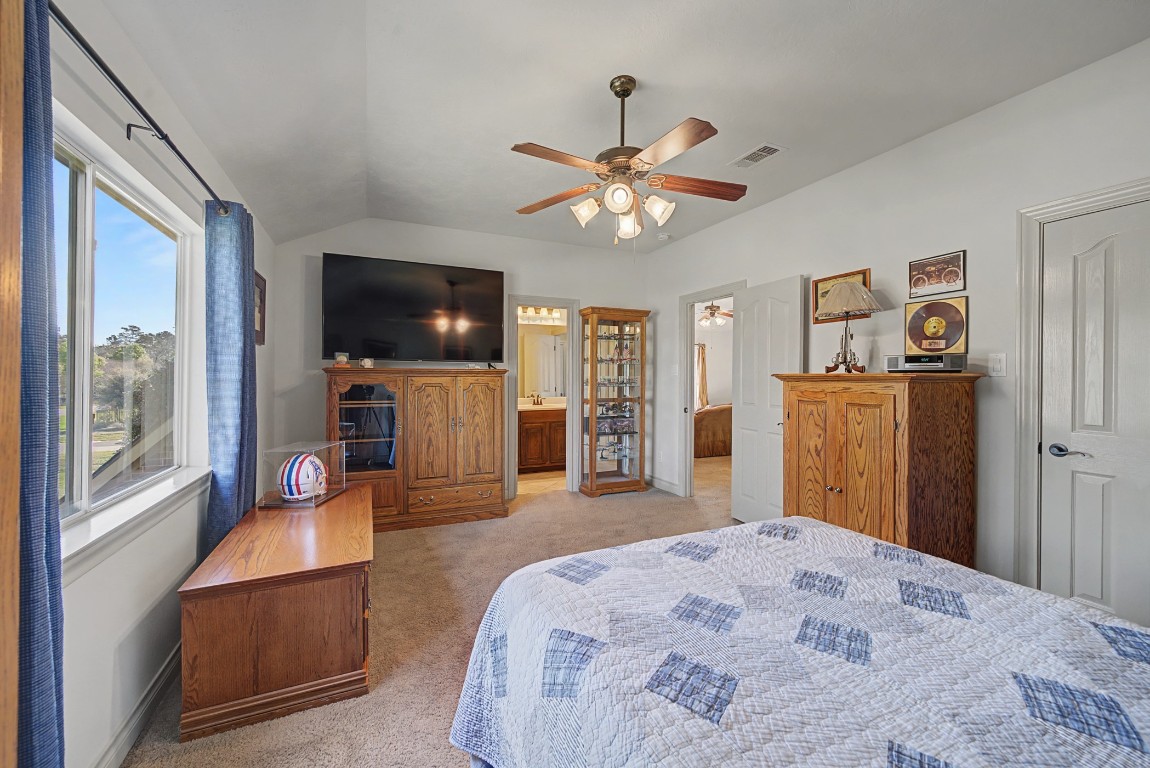 27223 Blue Cedar Lane Spring, TX 77386 - Photo 34 of 50 a bedroom with furniture and a flat screen tv