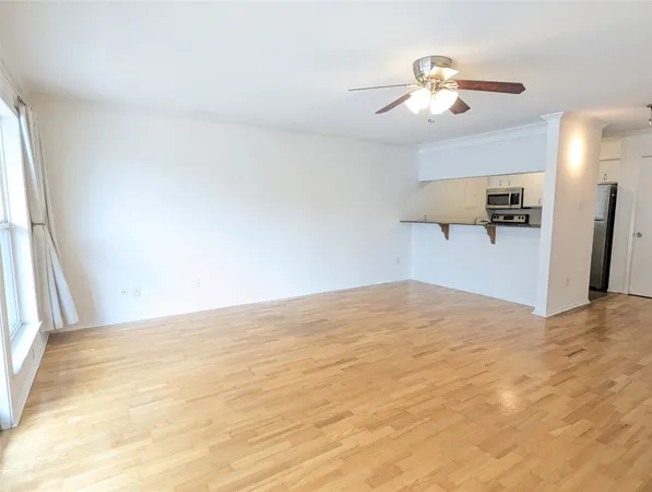 a kitchen with a refrigerator sink and microwave