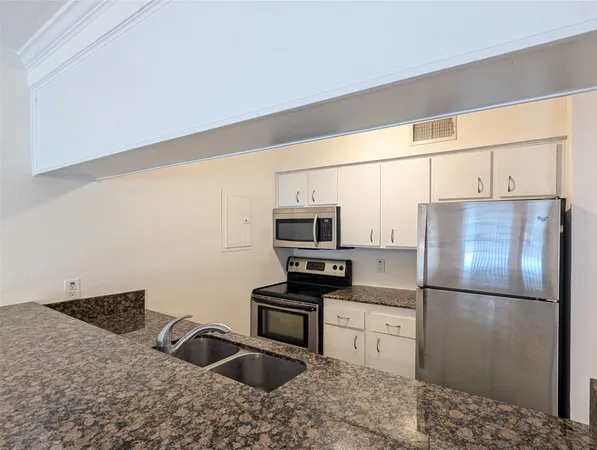 a bathroom with sink and mirror