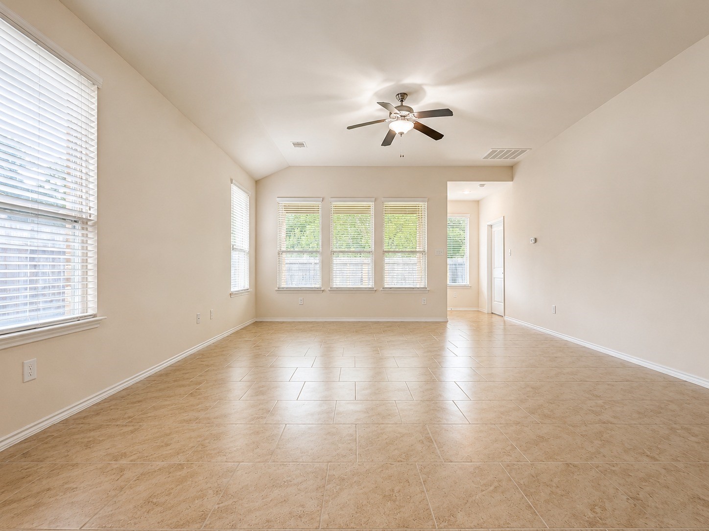 24315 Ravenna Landing Loop Spring, TX 77389 - Photo 9 of 37 wooden floor in an empty room with a window