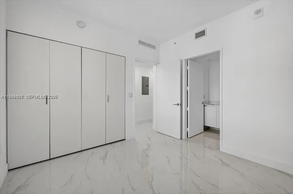 a view of a closet area with hallway