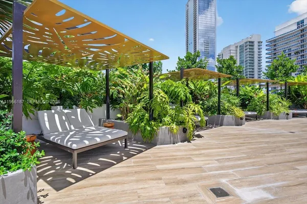 a view of a backyard with sitting area