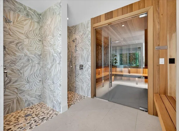 a view of a bathroom with a glass door shower and a bath tub