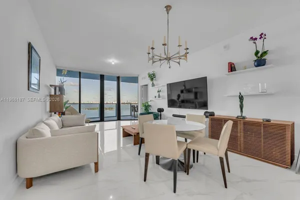 a view of a livingroom with furniture and window