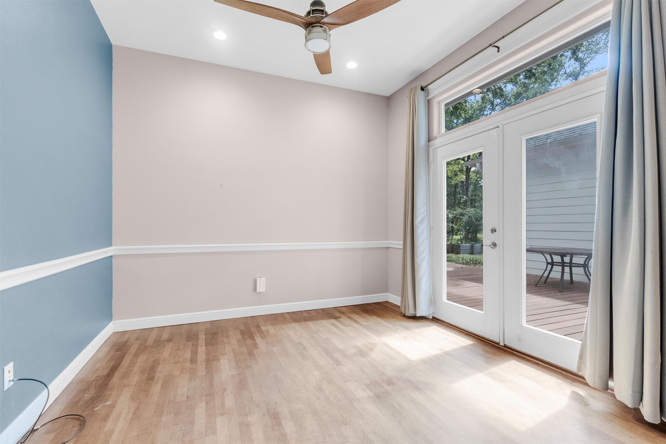 10331 Iron Ore Road Conroe, TX 77303 - Photo 12 of 47 This flex space has french doors opening to a deck with view of the property.