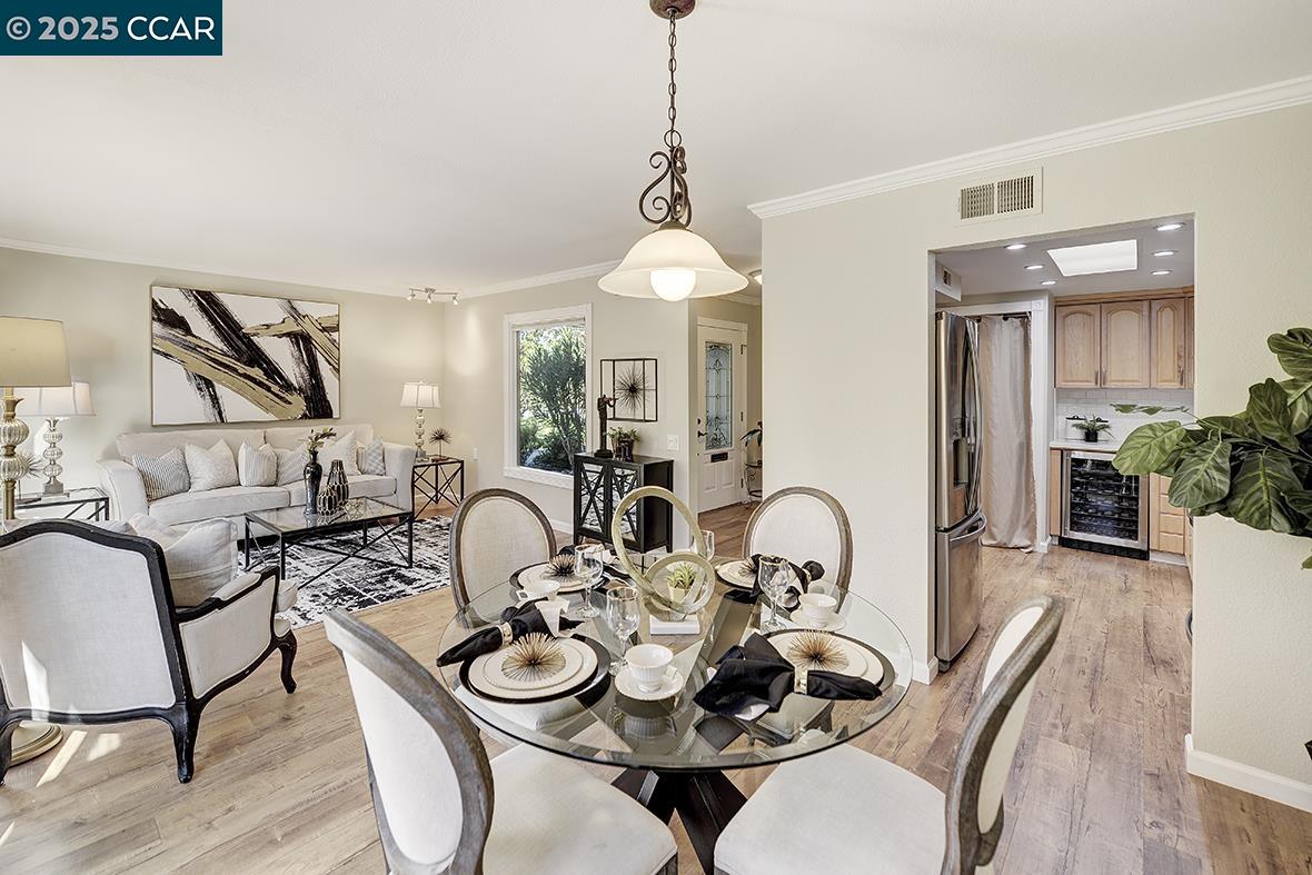2424 Tice Creek Drive, Unit 2 Walnut Creek, CA 94595 - Photo 11 of 54 a dining room with furniture and wooden floor