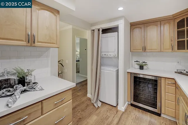 a kitchen with cabinets a sink and appliances