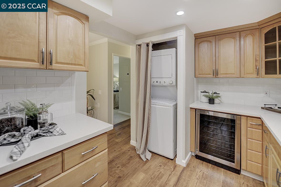 2424 Tice Creek Drive, Unit 2 Walnut Creek, CA 94595 - Photo 13 of 54 a kitchen with white cabinets and sink