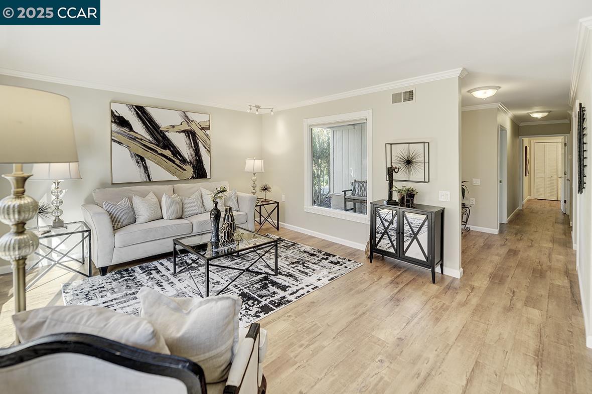2424 Tice Creek Drive, Unit 2 Walnut Creek, CA 94595 - Photo 18 of 54 a living room with furniture and wooden floor