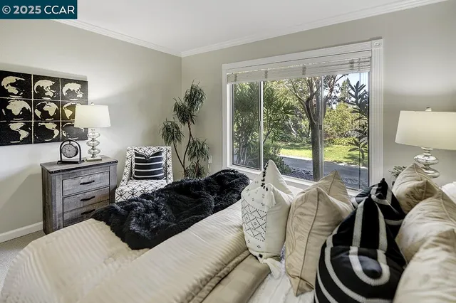 a bedroom with a bed and ceiling fan