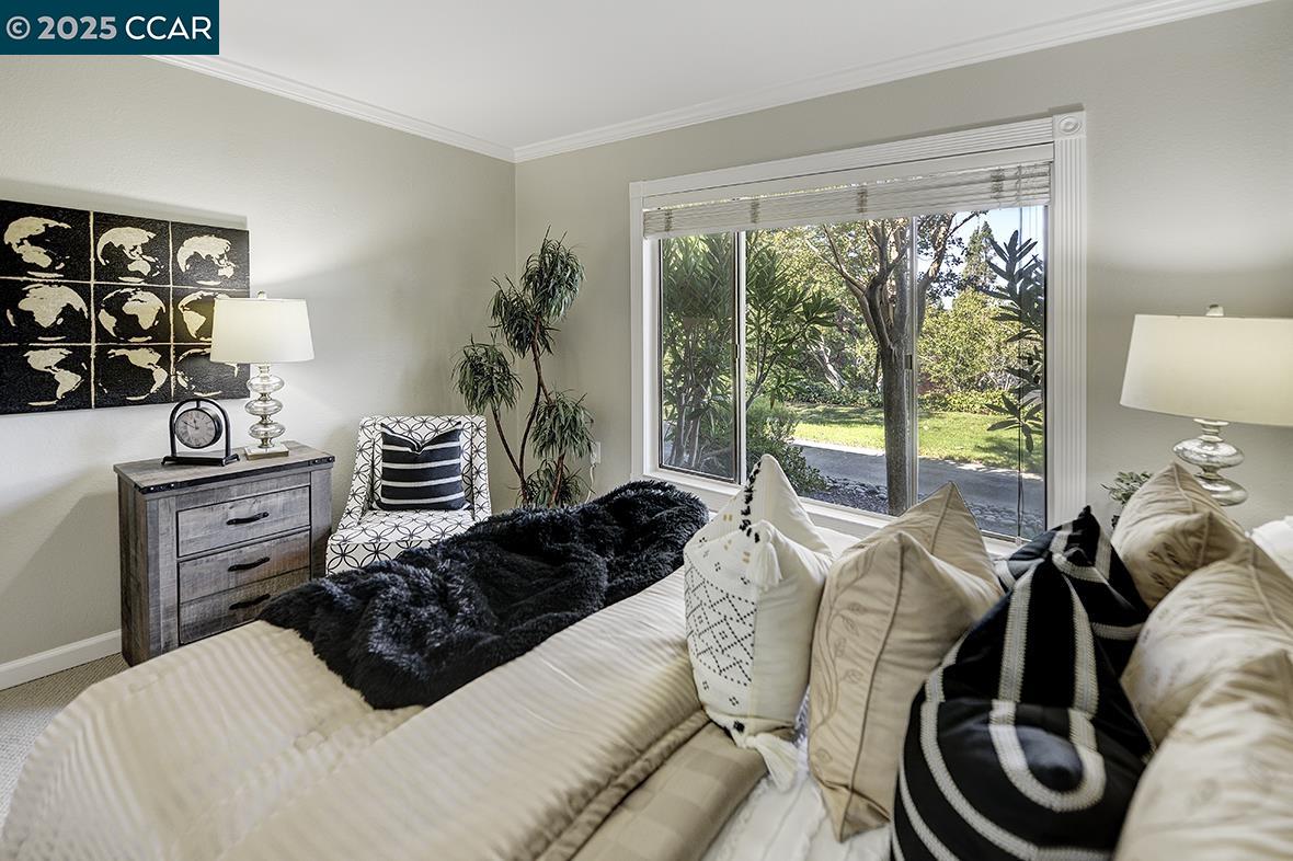 2424 Tice Creek Drive, Unit 2 Walnut Creek, CA 94595 - Photo 23 of 54 a bedroom with furniture and a window