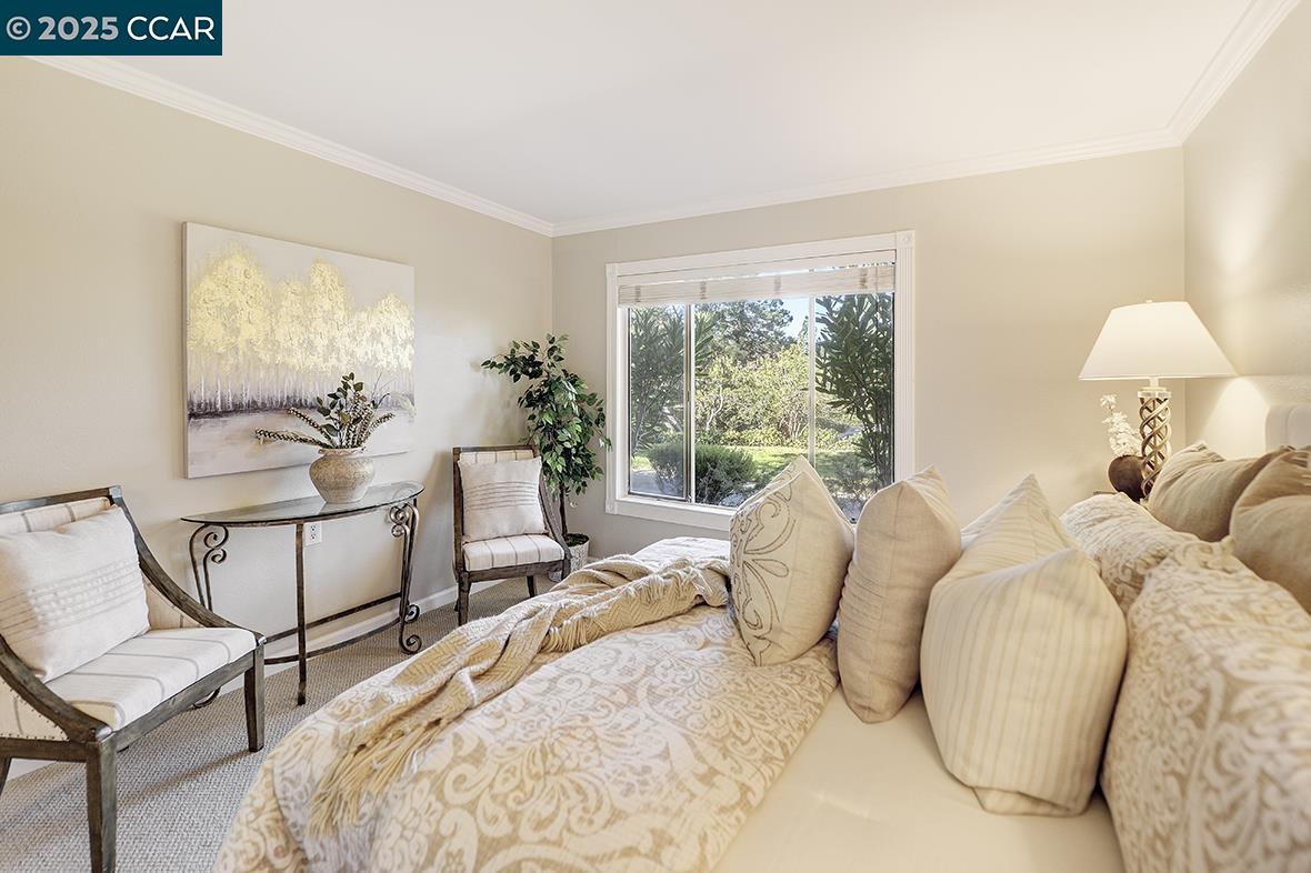 2424 Tice Creek Drive, Unit 2 Walnut Creek, CA 94595 - Photo 30 of 54 a bed room with two bed and a chair