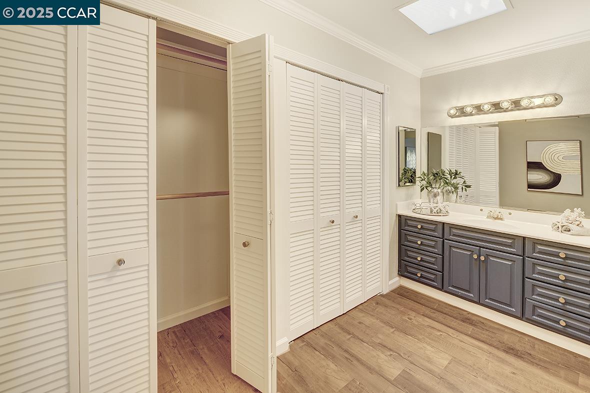 2424 Tice Creek Drive, Unit 2 Walnut Creek, CA 94595 - Photo 32 of 54 a spacious bathroom with a double vanity sink and a mirror