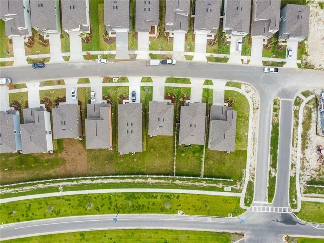 a view of an swimming pool with a yard